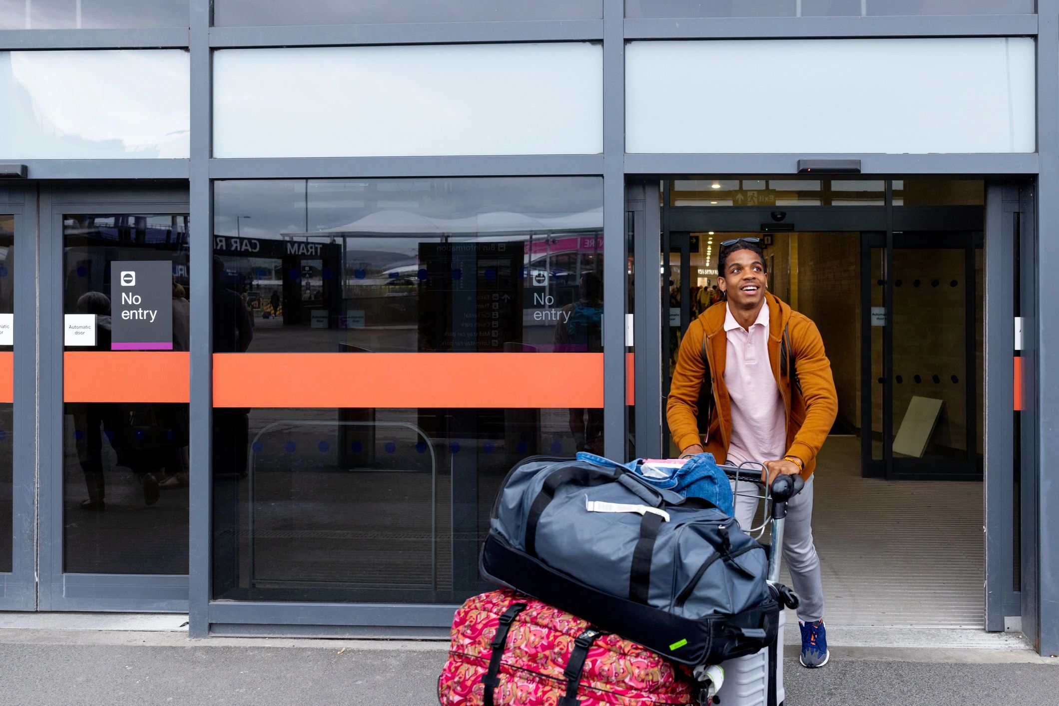 Solo traveler leaving the airport with luggage