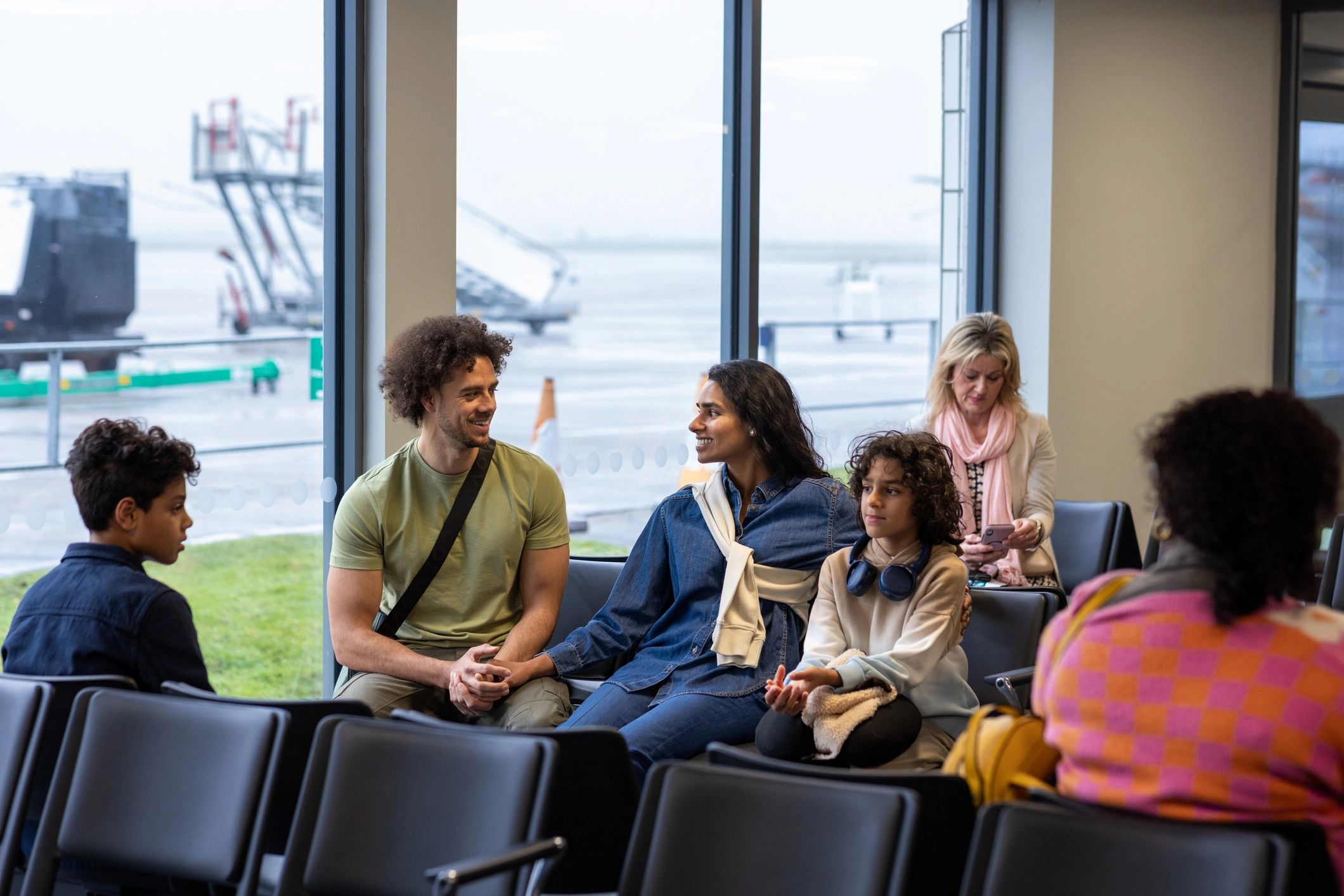 Travelers waiting in an airport lounge for a business trip