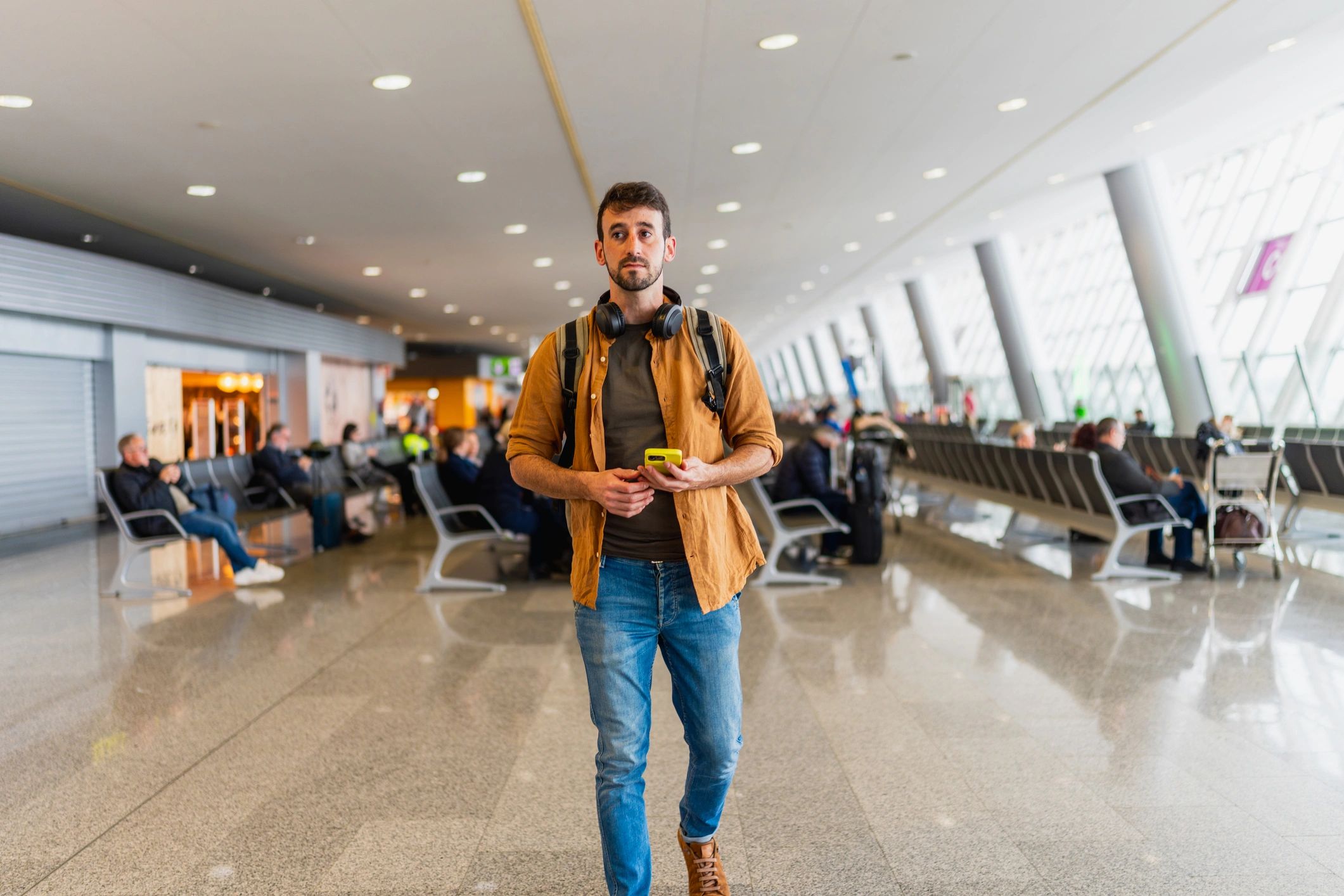 Business traveler walking through an airport terminal
